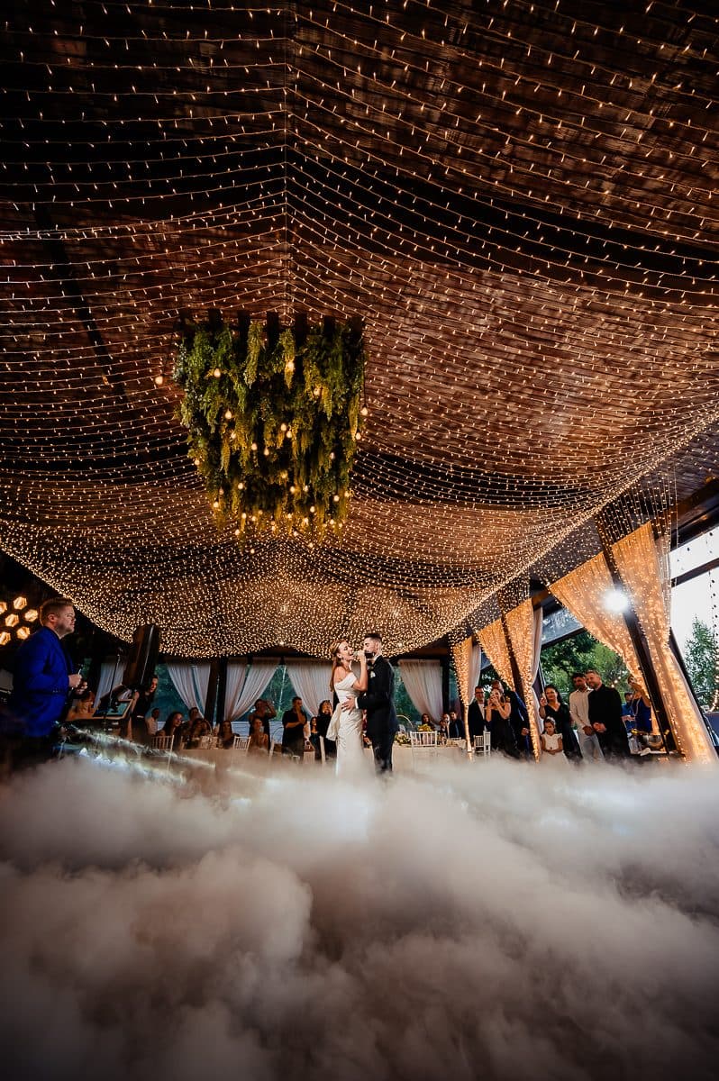First dance under a canopy of lights, low fog covering the floor