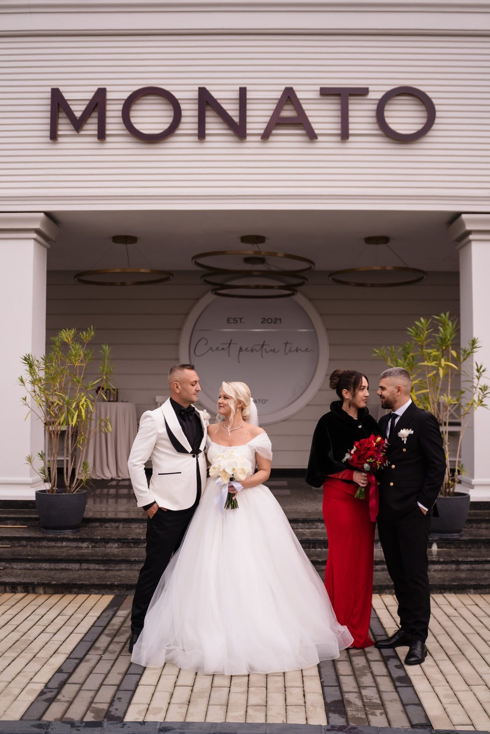 Bride and groom with their witnesses in front of the Monato entrance